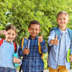 Group of cute little pupils outdoors